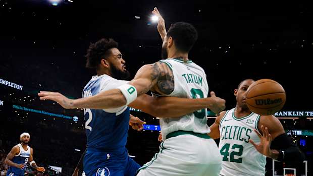 Karl-Anthony Towns tries to pass around Jason Tatum
